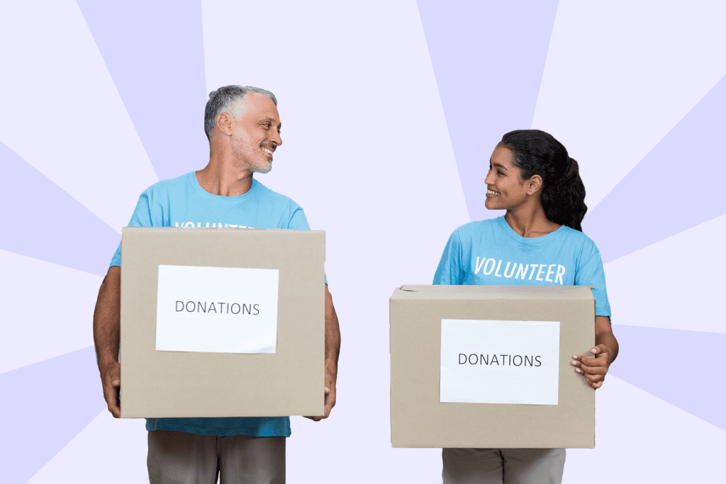 man and woman holding donation boxes