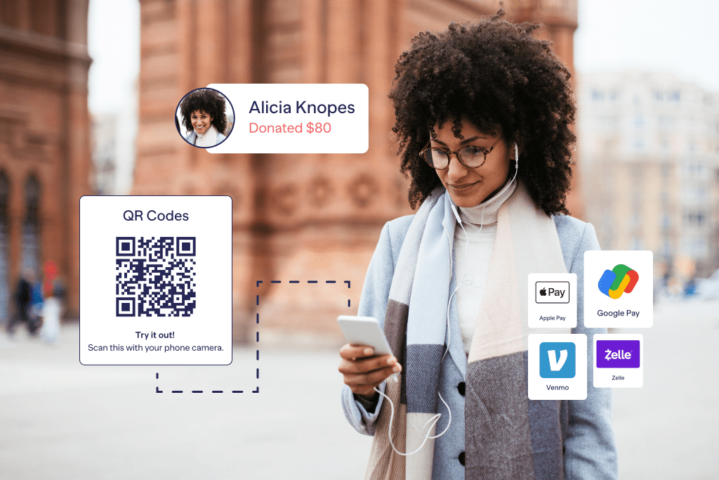 woman looking at phone with QR code