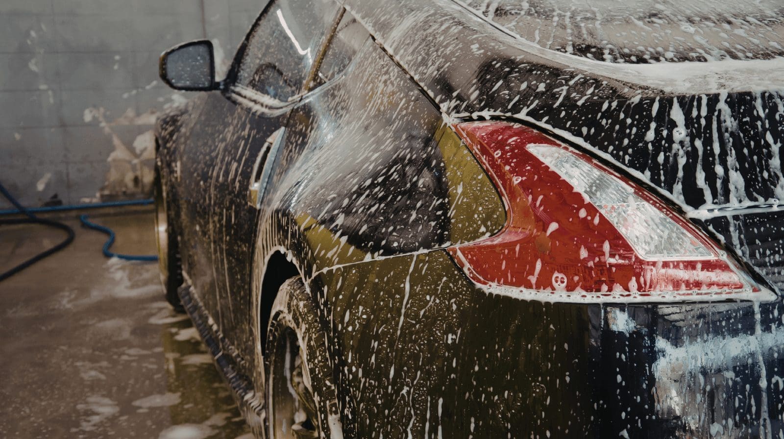 Volunteers wash cars in exchange for donations