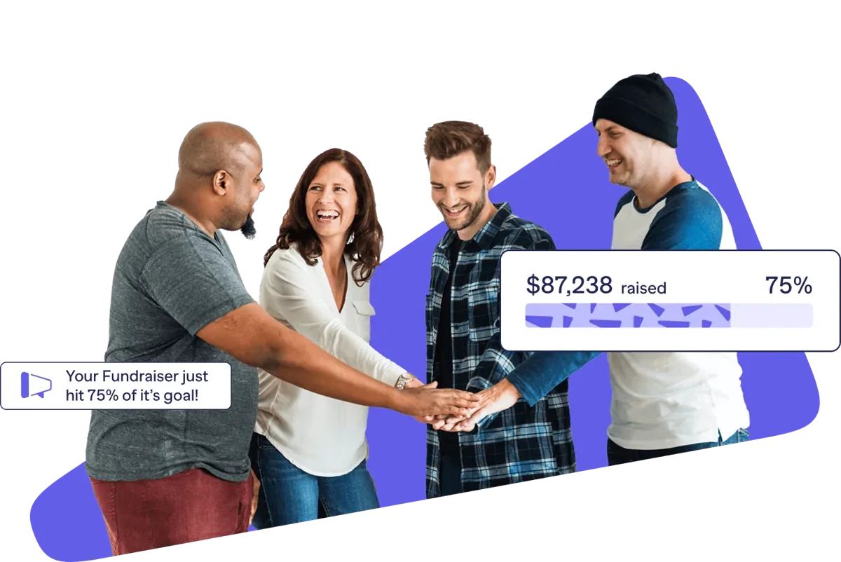 A team putting their hands together as their fundraiser reaches 75% of its goal
